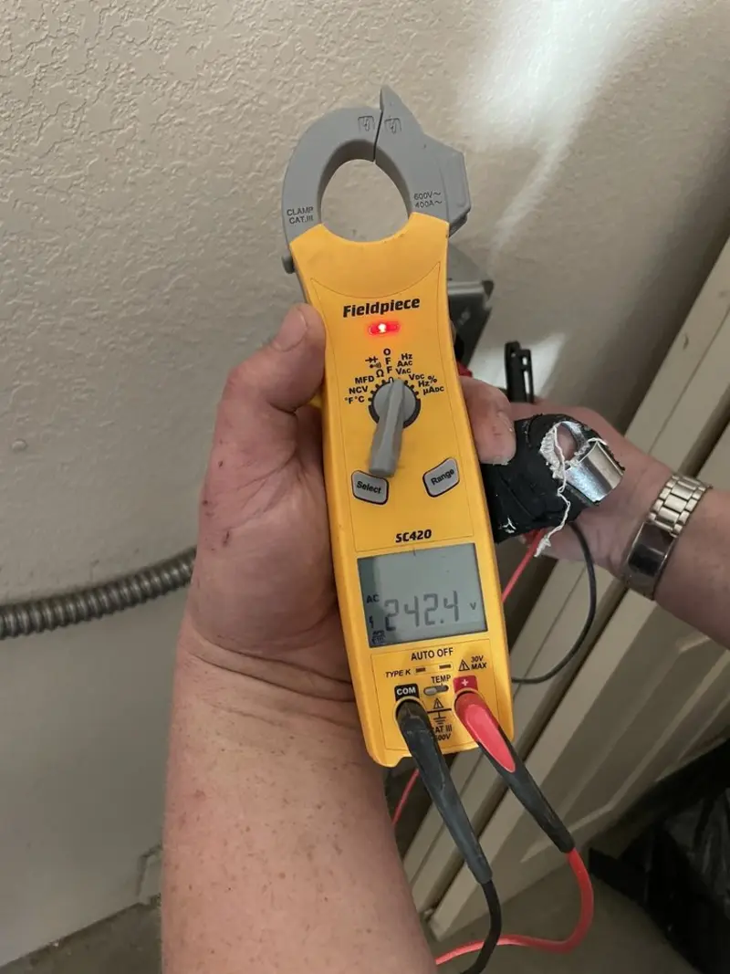 Voltage testing with clamp meter during Whole House Surge Protector in Clintonville